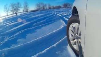 Subaru Outback on snow with stock Bridgestone Dueler H/P Sport AS Tires